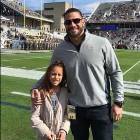 Joelle Anoa'i with her dad, Roman Reigns