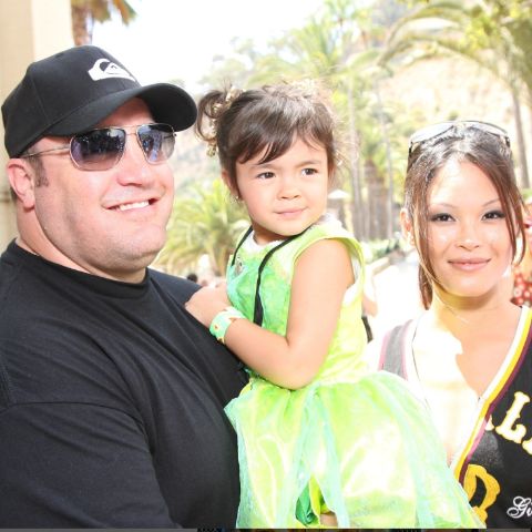 Steffiana De La Cruz with her husband, Kevin James, and their daughter
