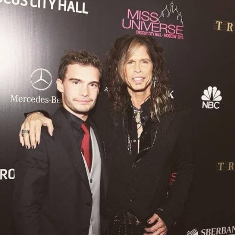 Taj Monroe Tallarico with his father, Steven Tyler during an event
