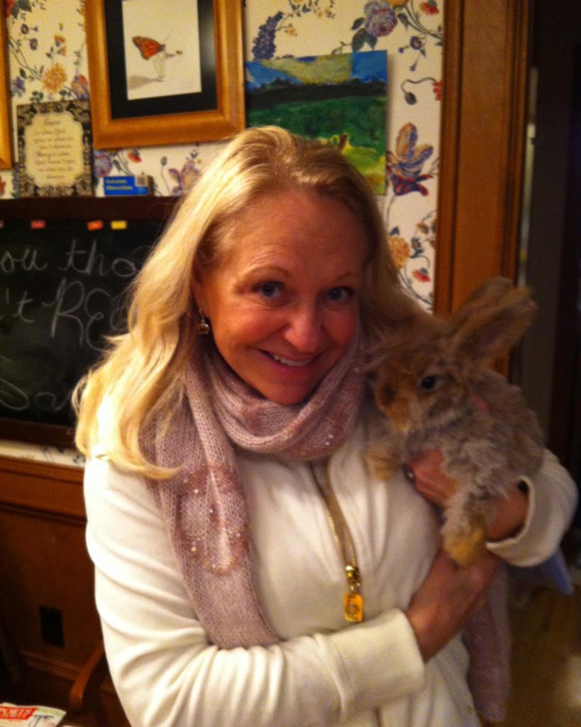 Renee Chahoy holding rabbit in her hand